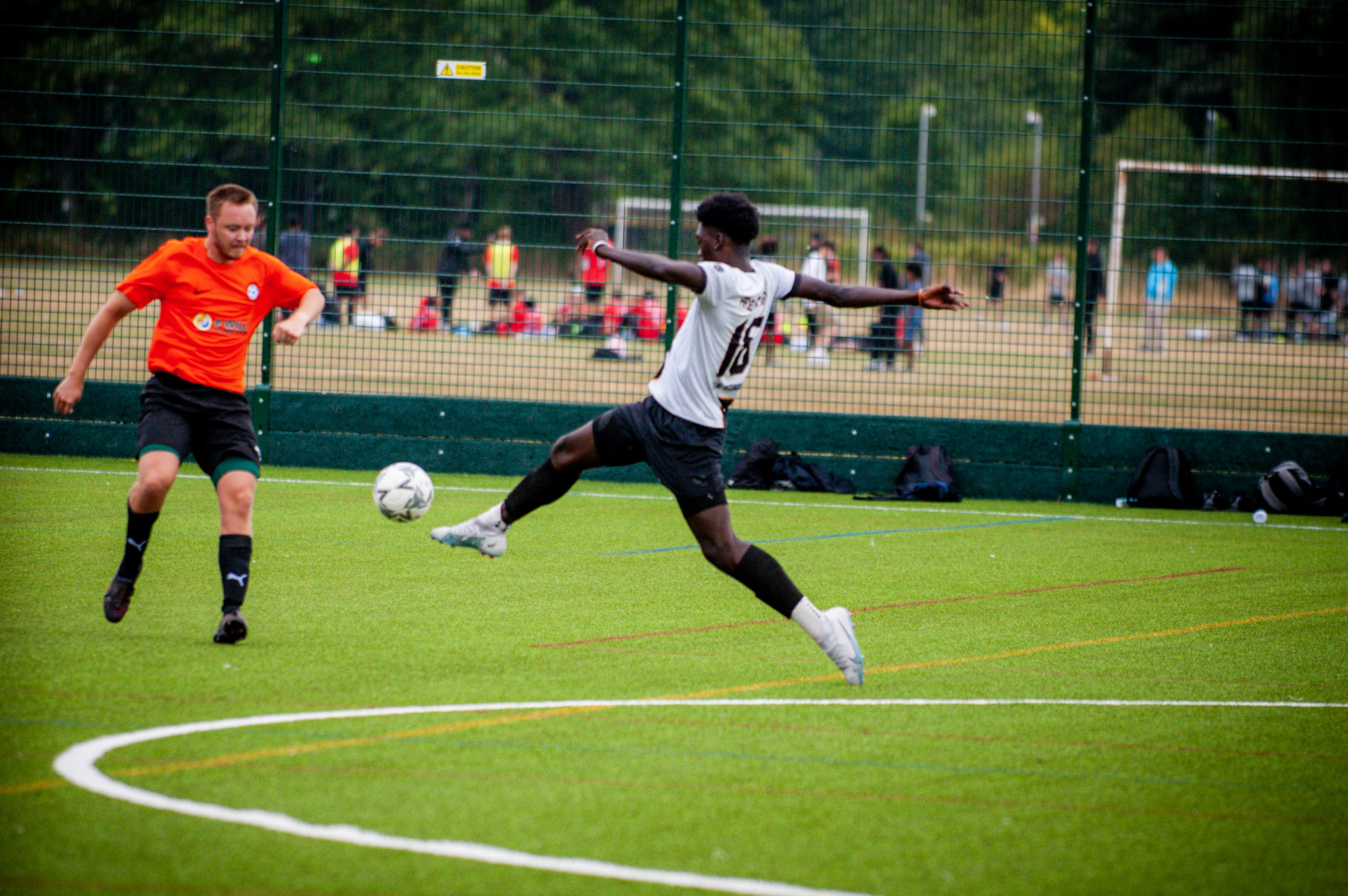 AR Elite player striking the ball under pressure