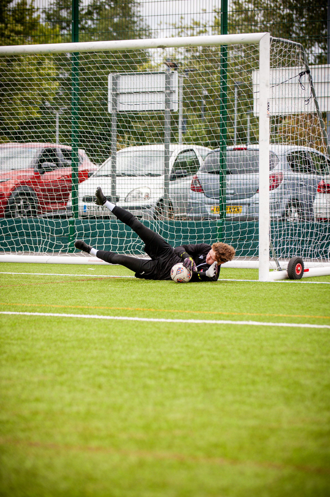 AR Elite Men's Team goalkeeper dives to make a save