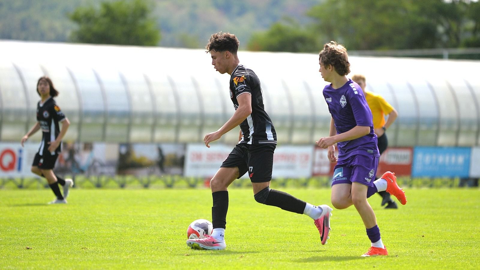 AR Elite Academy player competing for the ball at the Budweis International Cup