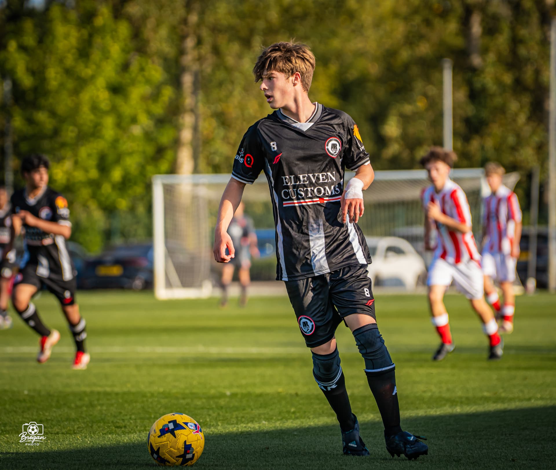 AR Elite midfielder in possession against Stoke City