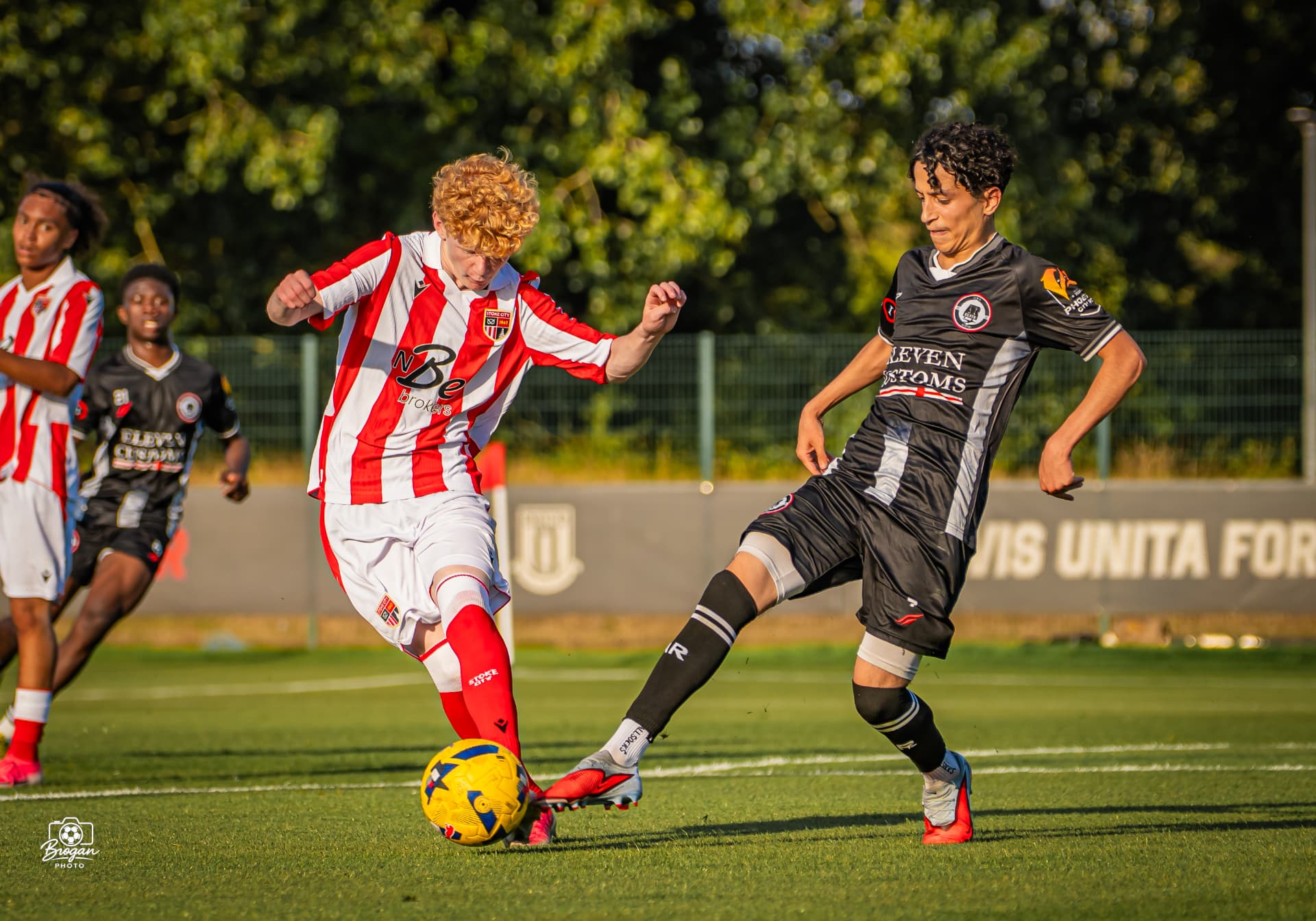 AR Elite defender closing down a Stoke City forward