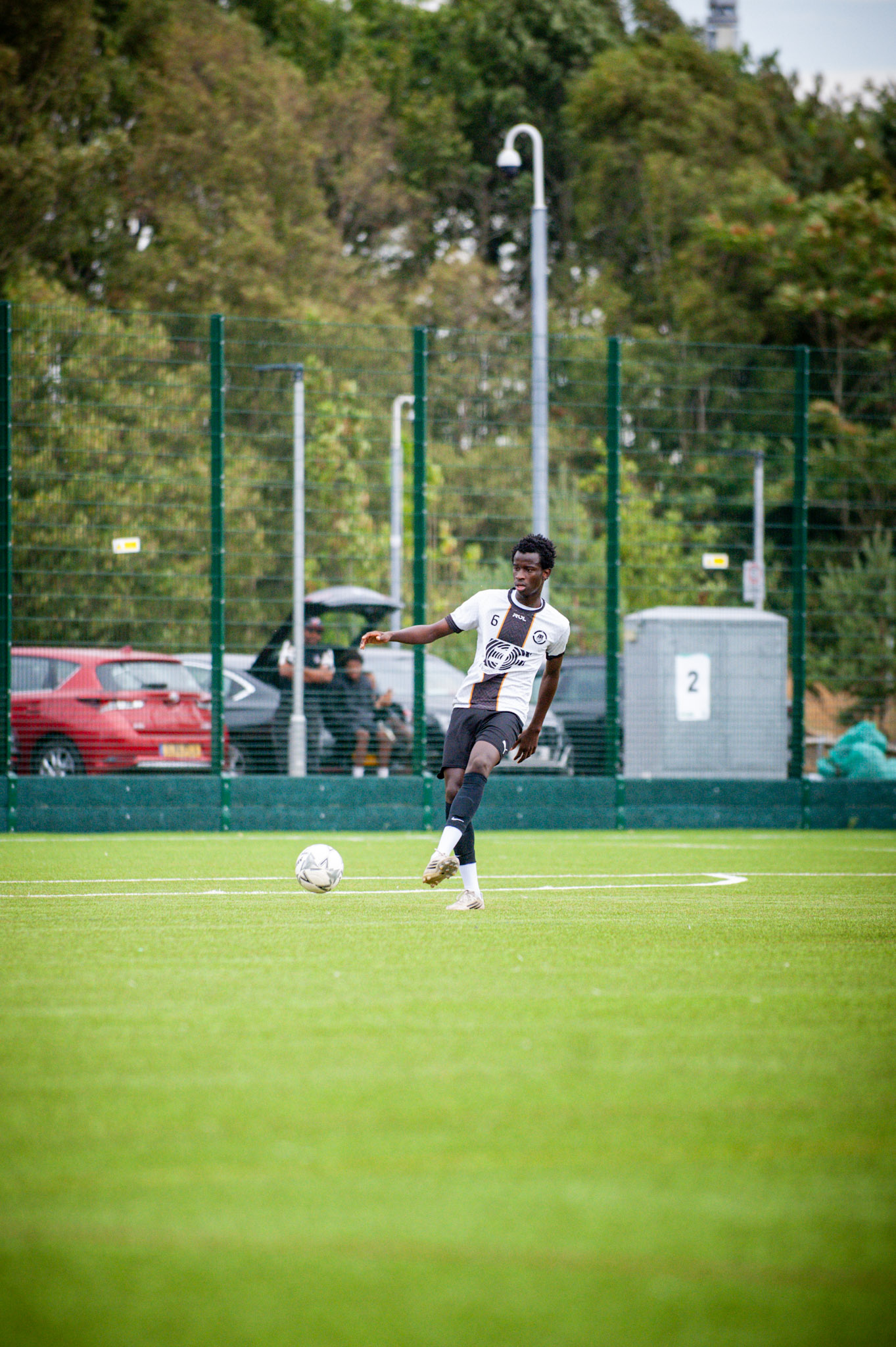 AR Elite player crossing the ball into the box